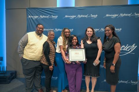 Award of Merit - Jackson State University for project honoring the life and legacy of Jim Hill. Accepting are Heather Denne, JSU director of community engagement, and staff.