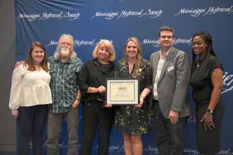 Award of Merit - Mississippi Humanities Council for its Museum on Main Street program. Accepting are MHC director Stuart Rockoff with current and former MHC staff.