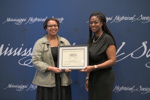 Award of Merit - Mississippi Museum of Art for its exhibit A Movement in Every Direction about the Great Migration. Accepting is Lydia Jasper.