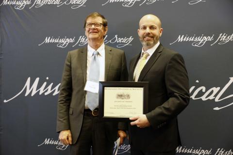 Award of Merit - Hancock County Historical Society for the production of the historical drama Mercy Train: Next Stop Bay St. Louis—an original one-act play about the history of Orphan Trains and the lives of five children from Bay St. Louis in the early 1900s. Accepting is Jim Codling.