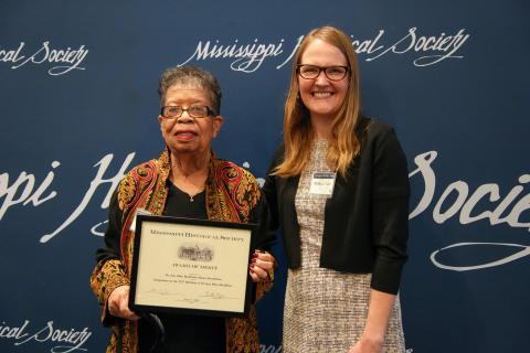 Award of Merit - Dr. Jane Ellen McAllister House Foundation for organizing a symposium for the first African American woman to earn a Ph.D. in education. Accepting is Bettye Gardner.