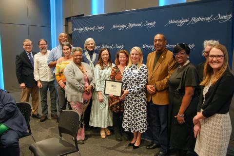 Award of Merit - Mississippi Heritage Trust for preserving Freedom Houses. Accepting is Lolly Rash and MHT board members.