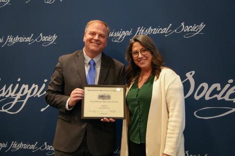 History Teacher of the Year - Carlous Smith of Florence Middle School. Presented by Kari Baker, MDAH director of education.